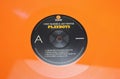 Closeup of orange color vinyl record label of Art Pepper and Chet Baker Playboys fifties Jazz album