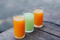 Closeup orange and guava juice on wood background, drink for healthy concept, selective focus Royalty Free Stock Photo