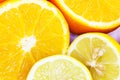 One orange and lemon cut in half. Royalty Free Stock Photo