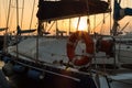 Closeup of Orange Lifebuoy and Rolled Rope on Sailing Boat