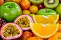 Closeup orange and passion fuits slice with group of ripe fruits