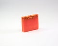 Closeup of an orange-scented soap bar isolated on a white background Royalty Free Stock Photo