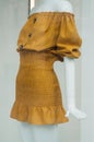 orange summer dress on mannequin in women fashion store showroom