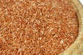 Closeup organic Brown rice in burlap bag at asian fresh market gourmet store, the most selective choice for vegetarian food Royalty Free Stock Photo