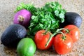 Closeup organic fresh salsa ingredients red onion cilantro tomato avocado lime