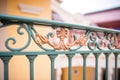 closeup of ornate wroughtiron balcony railings on mediterranean facade