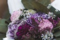 Closeup outdoor portrait of beautiful fresh cut flowers in different shades of pink and violets with two shiny golden Royalty Free Stock Photo