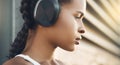 Closeup, outdoor and woman with headphones, fitness and exercise with focus, workout goal and wellness. Female person