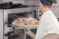 Closeup oven chef pizza steam