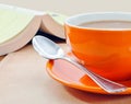 Closeup of orange coffee cup