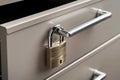 closeup of padlock on a file cabinet drawer