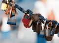 Closeup of a padlock hanging on chain link of the bridge / Fence Royalty Free Stock Photo