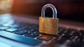 A closeup of a padlock on a laptop symbolizing the need for robust encryption and secure access controls to prevent