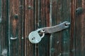 Closeup of a padlock on a vintage wooden gate on an old shed in Toten, Norway Royalty Free Stock Photo