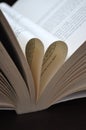 Closeup pages of an open book, with heart shaped pages Royalty Free Stock Photo