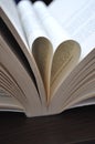 Closeup pages of an open book, with heart shaped pages Royalty Free Stock Photo