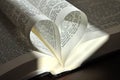 Closeup pages of an open book, with heart shaped pages Royalty Free Stock Photo