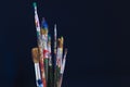 Closeup of paint brushes isolated on blue background Royalty Free Stock Photo