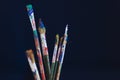 Closeup of paint brushes isolated on blue background Royalty Free Stock Photo