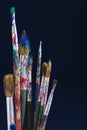 Closeup of paint brushes isolated on blue background Royalty Free Stock Photo