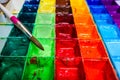 Closeup paint tray with paintbrush on wood background