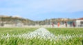 Closeup of painted boundary line of a green football field. Royalty Free Stock Photo