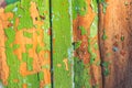 Closeup painted wooden board in a crack