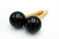 A pair of black maracas lying on a white underground Royalty Free Stock Photo