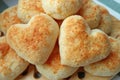 Pair of Heart Shaped Fresh Baked Pao de Queijo or Brazilian Cheese Breads on the Pile Royalty Free Stock Photo