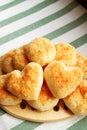 Delectable Heart Shaped Fresh Baked Pao de Queijo or Brazilian Cheese Breads on the Pile Royalty Free Stock Photo