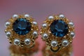 Closeup of pair of earrings with diamonds