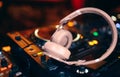 Closeup pair of headphones for DJ.cd mp4 music deejay mixing desk music party in nightclub. Club console for experiments with Royalty Free Stock Photo