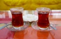 Pair of Hot Turkish Tea with Plate of Sugar Cubes in the Backdrop Royalty Free Stock Photo