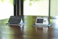 Closeup pair of pop up electrical outlets installed on the surface of wooden table in the office Royalty Free Stock Photo