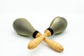 A pair of rawhide maracas lying on a white underground Royalty Free Stock Photo