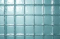 Closeup of pale blue glass brick wall pattern. Textured transparent squares form grid, offering soft diffused light. Modern Royalty Free Stock Photo
