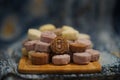 Closeup of pandan snow skin mooncakes served on a wooden serving board