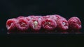 Closeup panorama at pile of fresh raspberries staffed with jelly served on black