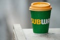Cup of coffee from subway brand abandonned in the street - subway is the american famous brand of fast food si