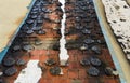 Closeup part of the building after the fire. A burnt facade and a visible brick wall.