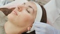 Closeup part of face depilation of eyebrows with a thread. Permanent tattooing of eyebrows. Royalty Free Stock Photo