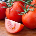 Closeup part of tomato with fresh dewy tomatoes