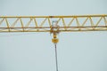 Closeup on part of yellow construction crane chain