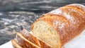 Closeup of a partially sliced loaf of homemade artisan wheat bread Royalty Free Stock Photo
