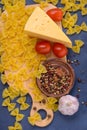 Closeup pasta, cheese, tomatoes, spices, garlic Royalty Free Stock Photo