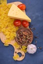 Closeup pasta, cheese, tomatoes, spices Royalty Free Stock Photo