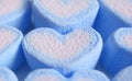 Closeup Pastel Blue and White Heart Shaped Marshmallow Candies in Rows