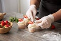 Closeup of a pastry chef decorating cupcakes Royalty Free Stock Photo