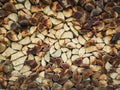 Closeup pattern of a stack of split logs, old dusty firewood. Pile texture of dry chopped wood Royalty Free Stock Photo