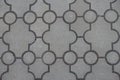 Closeup of pavement of curved gray interlocking concrete tiles Royalty Free Stock Photo